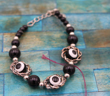 Load image into Gallery viewer, Handmade Black And White Beaded Eye Bracelet
